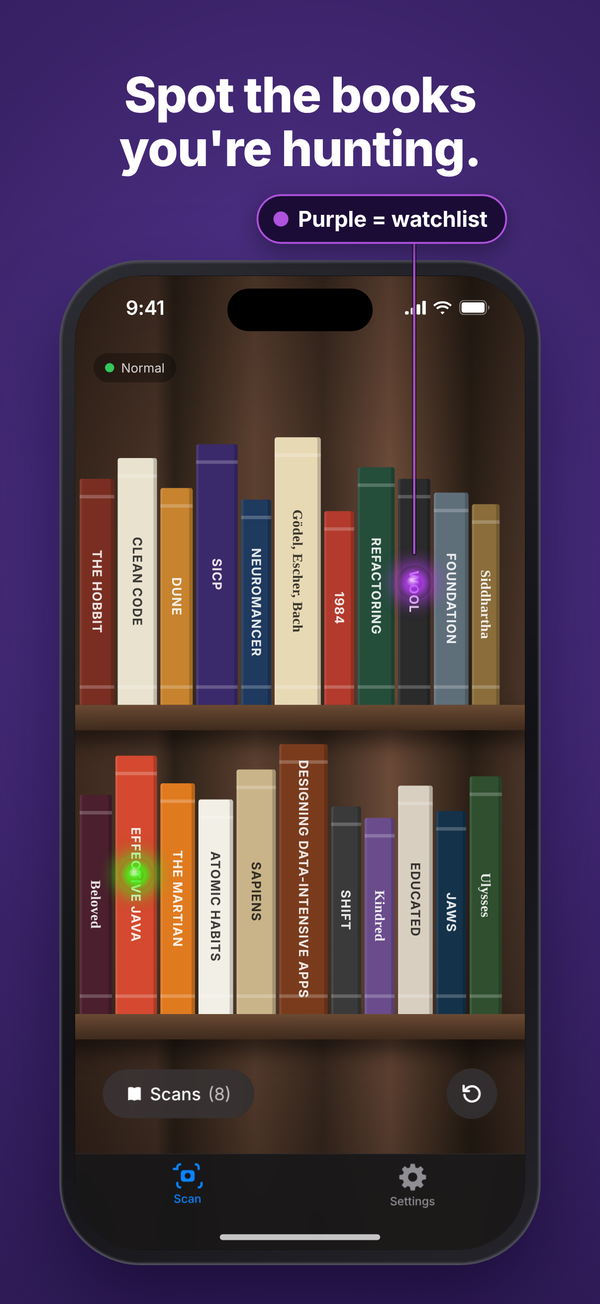 iPhone camera view of a bookshelf with a purple marker on a watchlist book